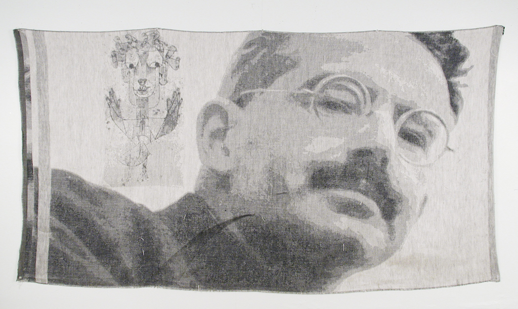 A digitally woven tapestry featuring an image of Walter Benjamin and his Angel of History