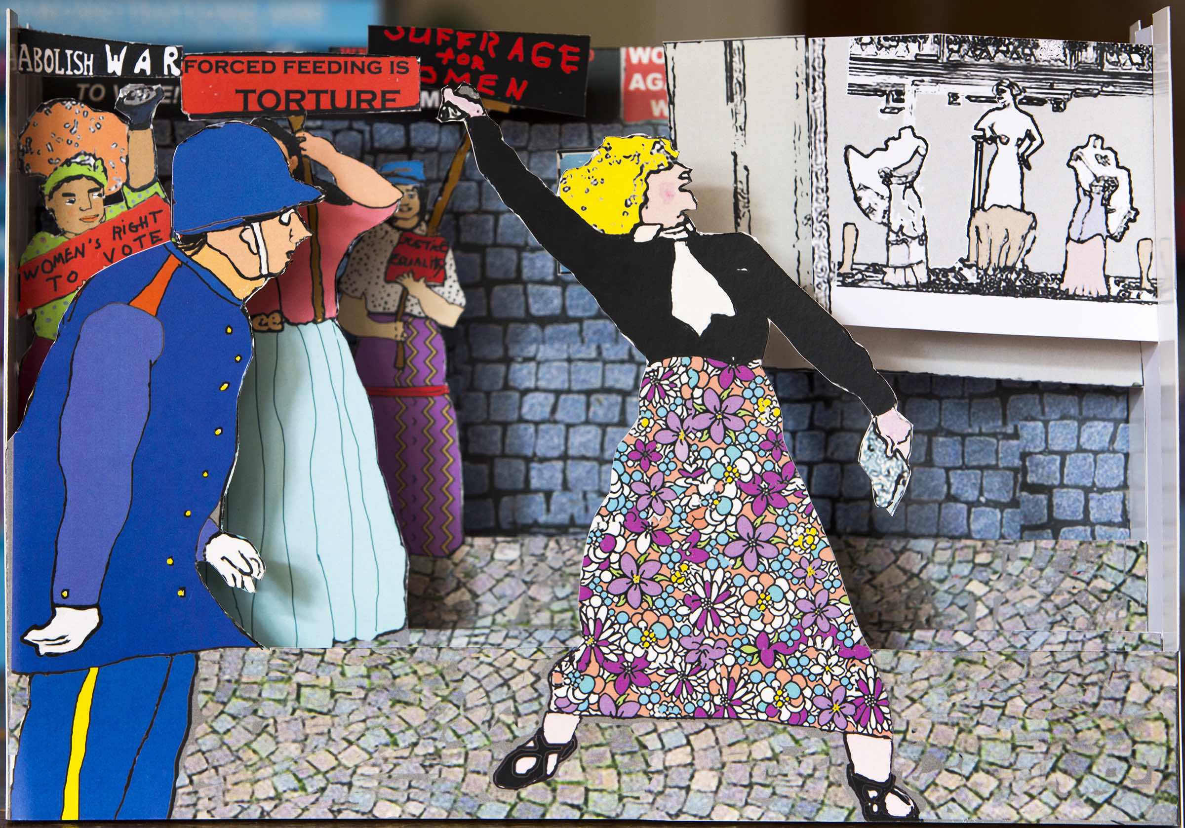 Pop-up depicting a suffragette throwing a rock, as a police officer looks on.