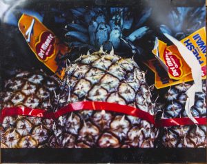 Pineapples for sale in a supermarket.